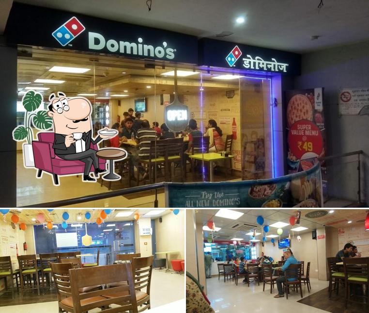 Take a seat at one of the tables at Domino's Pizza Sec-4 , Bokaro Steel City