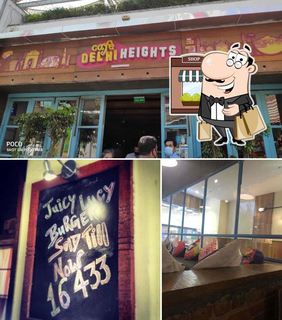 The photo of exterior and blackboard at Cafe Delhi Heights