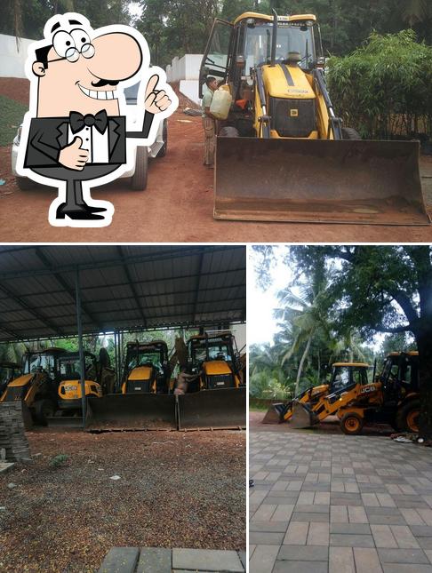 Look at the photo of Achumol Earth Movers