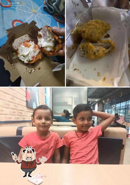 This is the image showing food and interior at Domino's Pizza Laxmi Mall, Hubballi