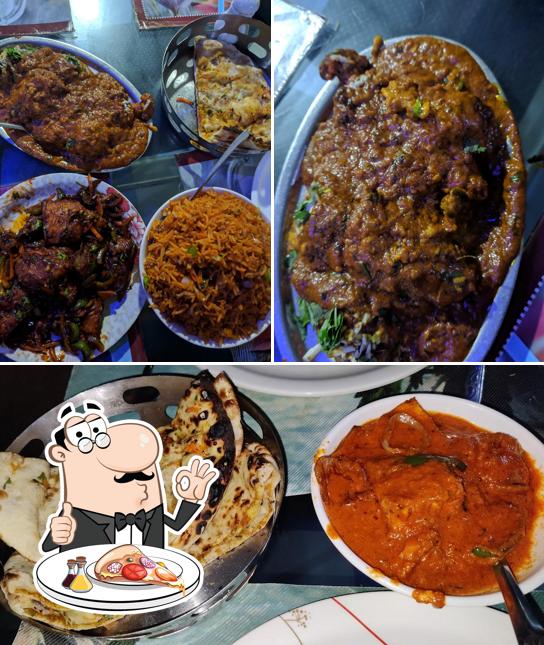 Try out pizza at Daawat Restaurant