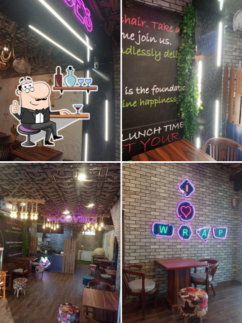 Take a seat at one of the tables at Wrap Caffe Dhakoli - The Best Cafe in Dhakoli