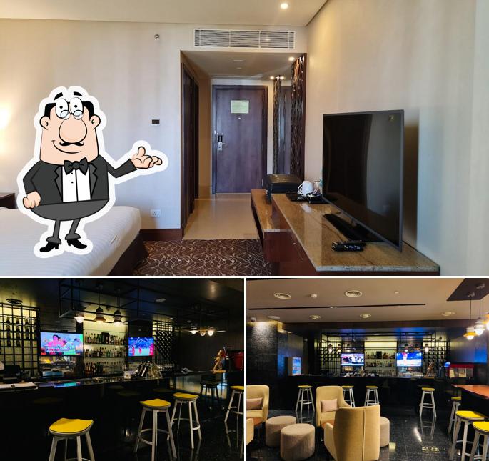 Take a seat at one of the tables at The Bar - Novotel Kochi Infopark