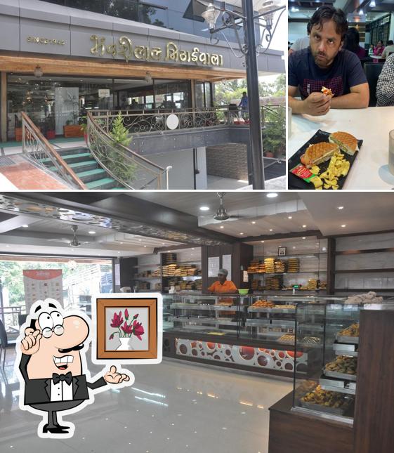 Take a seat at one of the tables at Bhanwarilal Mithaiwala