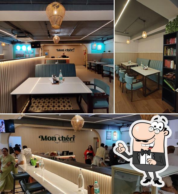 Take a seat at one of the tables at Mon Cheri Resto Cafe