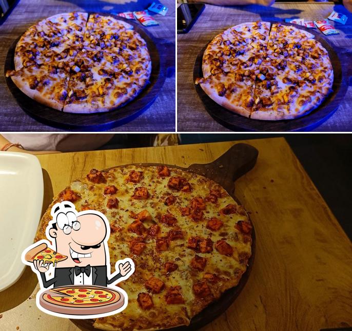 Get pizza at LIFE OF COFFEE (LoC) Cafe