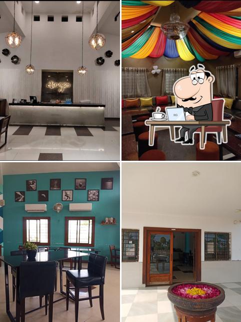 Take a seat at one of the tables at Aaranyam Restaurant & Cafe