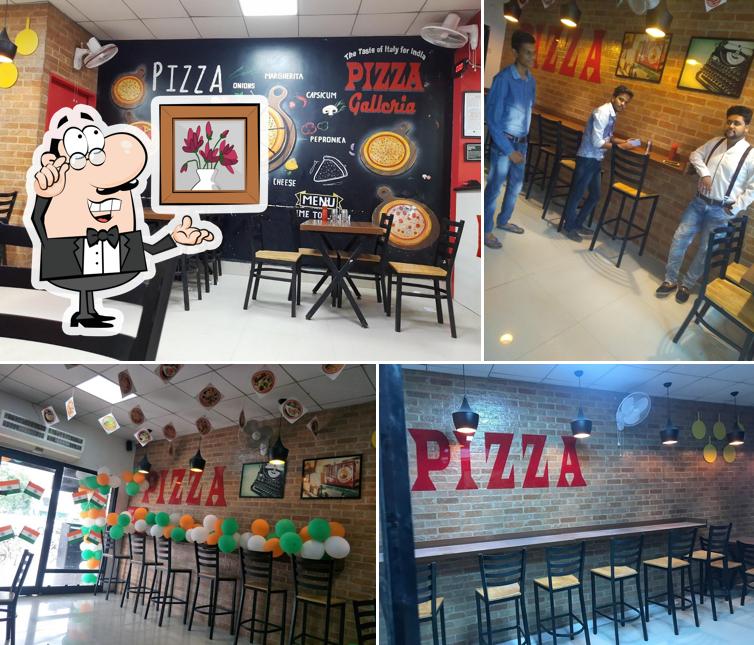 Take a seat at one of the tables at Pizza Galleria Karnal