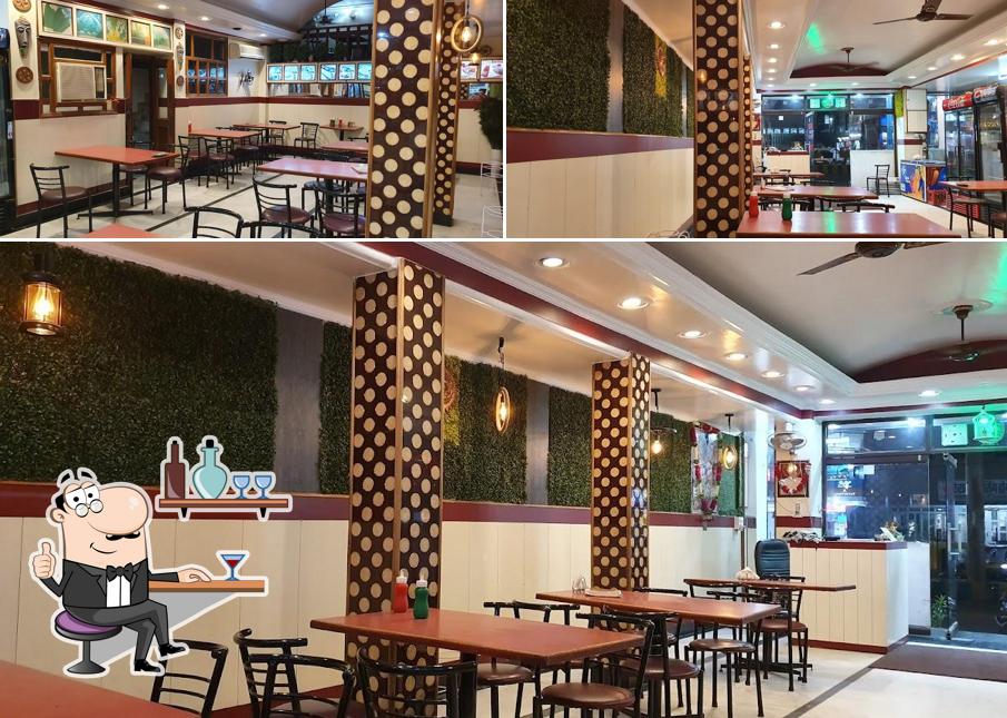 Take a seat at one of the tables at Baba Banwari Lal Restaurant