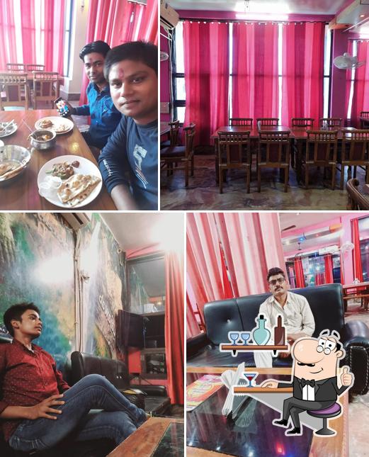 Take a seat at one of the tables at Wah Lajawab Manage By Green Planet Restaurants