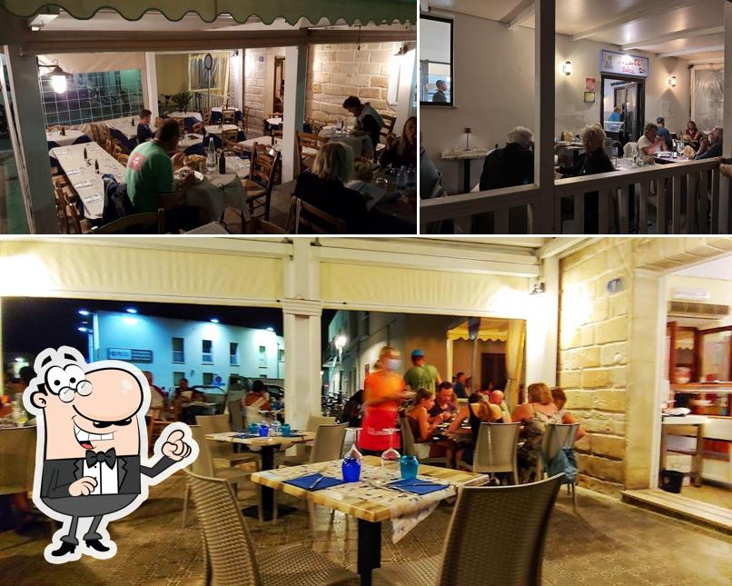 Siediti a un tavolo di Trattoria La Bettola