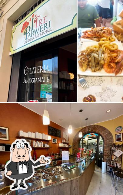 La immagine di interni e cibo da I Tre Papaveri
