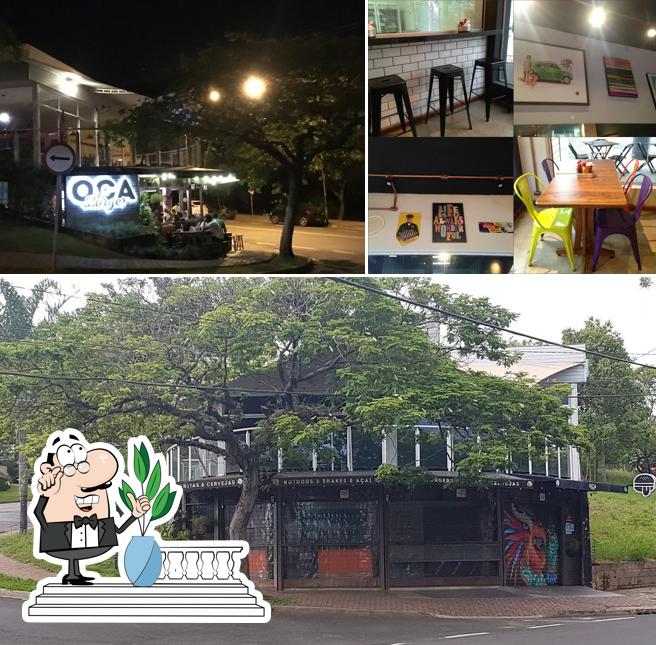 Esta é a imagem ilustrando exterior e mesa de jantar no Oca Burger Campolim