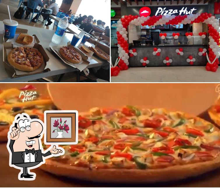Among different things one can find interior and pizza at Pizza Hut DN Regalia, Bhubaneshwar