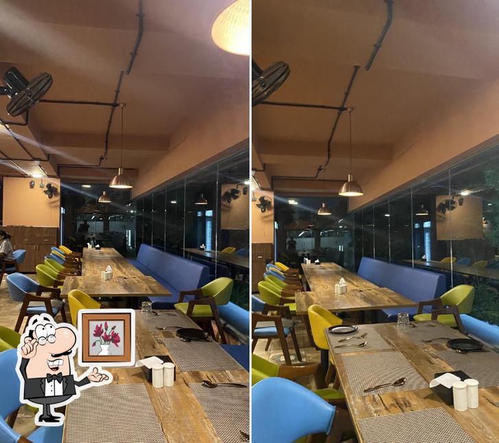 Take a seat at one of the tables at Satluj Punjab Vasna - Ikk Punjabi Chaska