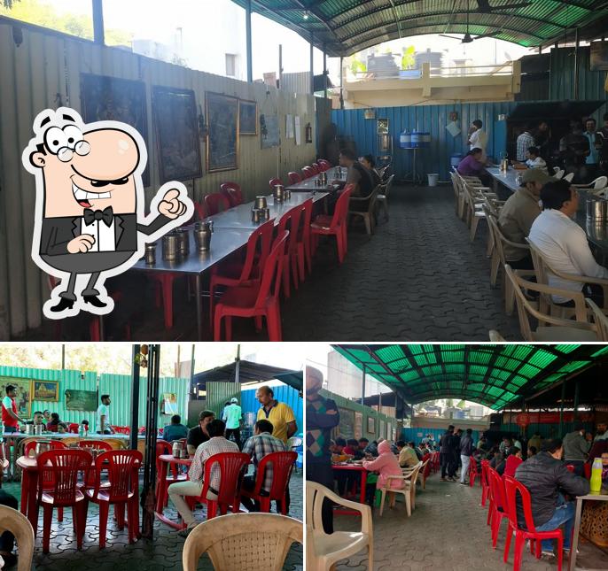 Take a seat at one of the tables at Tirupati Madras Cafe