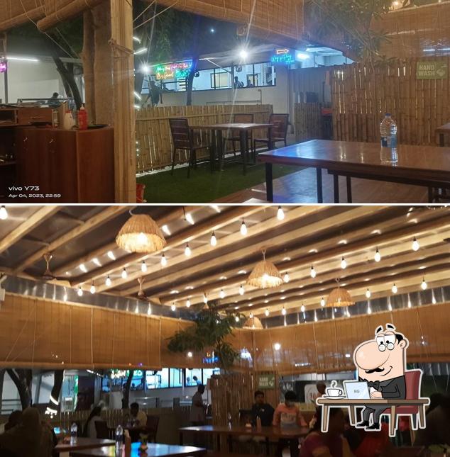 Take a seat at one of the tables at HI-FI MULTICUISINE RESTAURANT