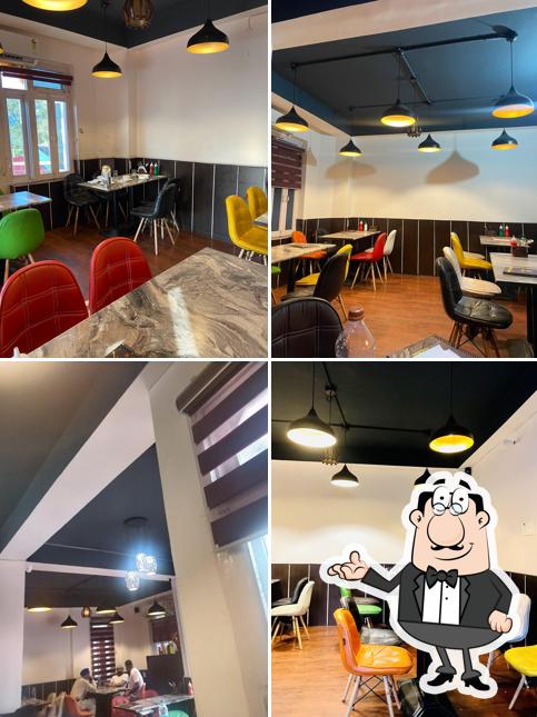 Take a seat at one of the tables at The Last Monk Cafe