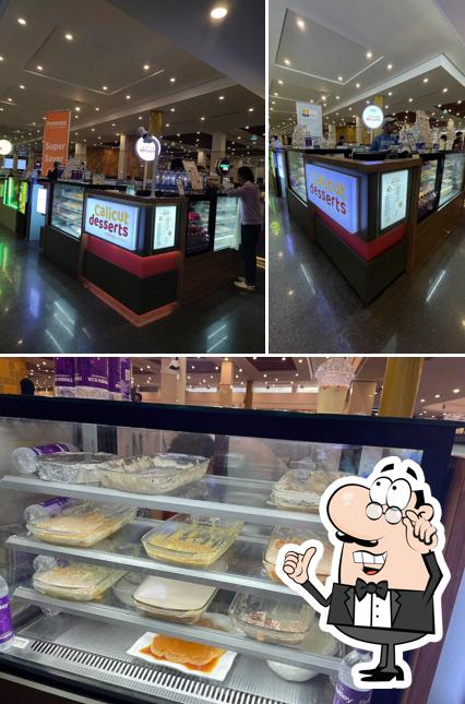 Take a seat at one of the tables at CALICUT DESSERTS