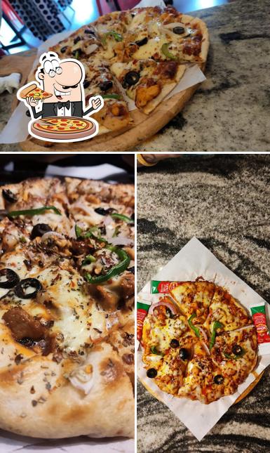 Get pizza at Taj Restaurant
