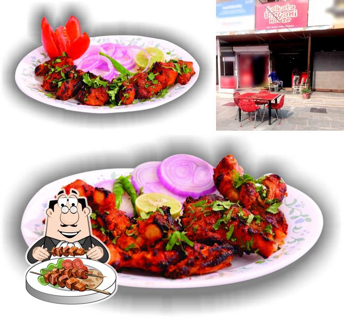 Among different things one can find food and interior at Kolkata Biryani House