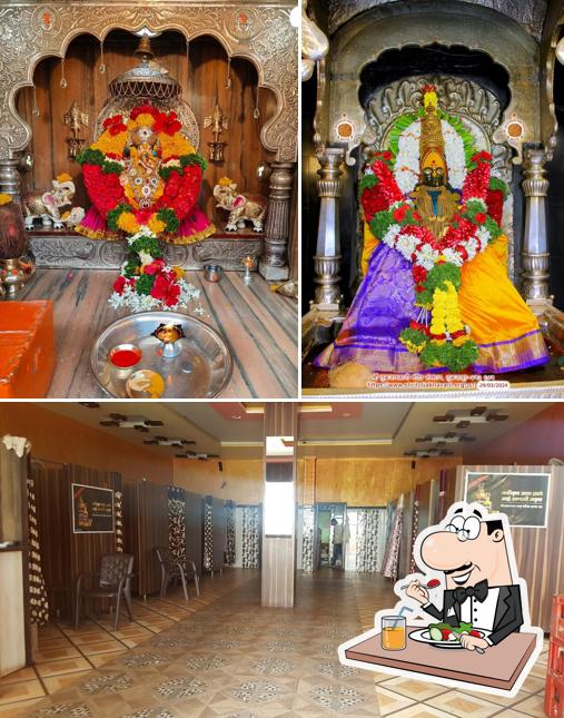 Among various things one can find food and interior at New Mohini Beer Bar & Lodge
