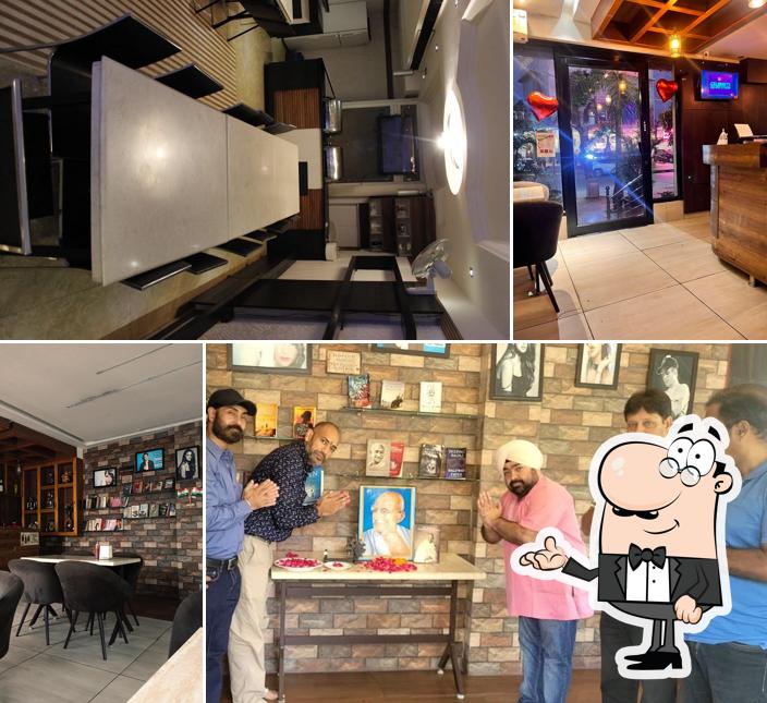 Take a seat at one of the tables at BANSAL SWEETS