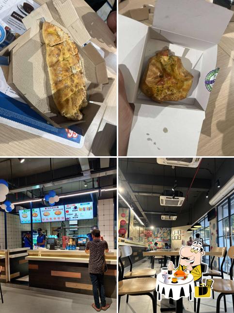 The photo of food and interior at Domino's Pizza Marine Drive, Kochi