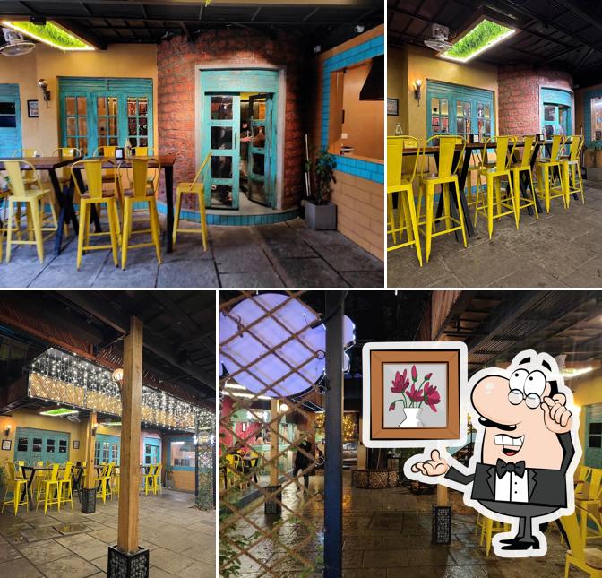 Take a seat at one of the tables at Pathirakozhi Restaurant, Aluva