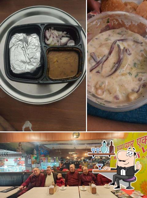 Take a seat at one of the tables at Nathu's Sweets