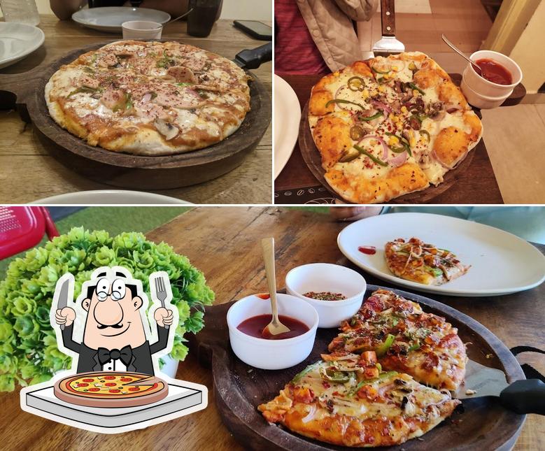 Get pizza at The Amrut's : Rustic Cafè
