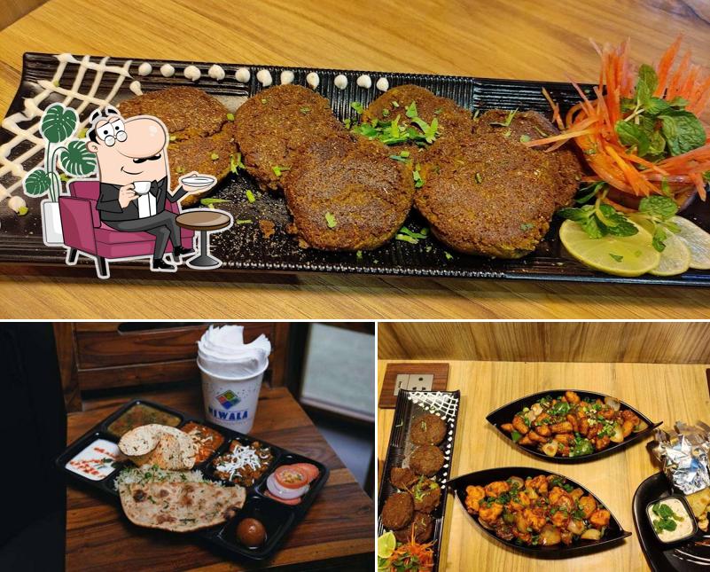 Take a seat at one of the tables at NIWALA Cafe & Restaurant