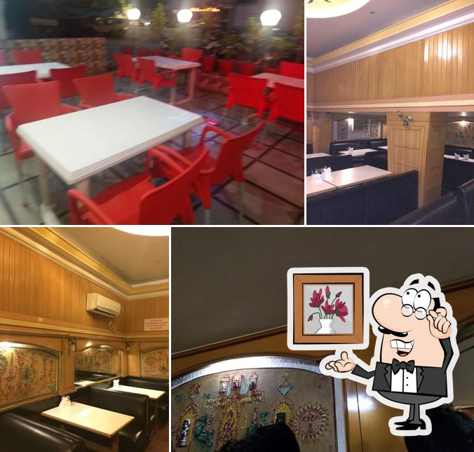 Take a seat at one of the tables at New Alka Restaurant