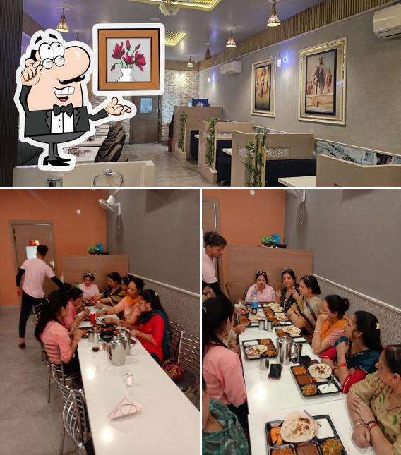 Take a seat at one of the tables at Dawat Restaurant