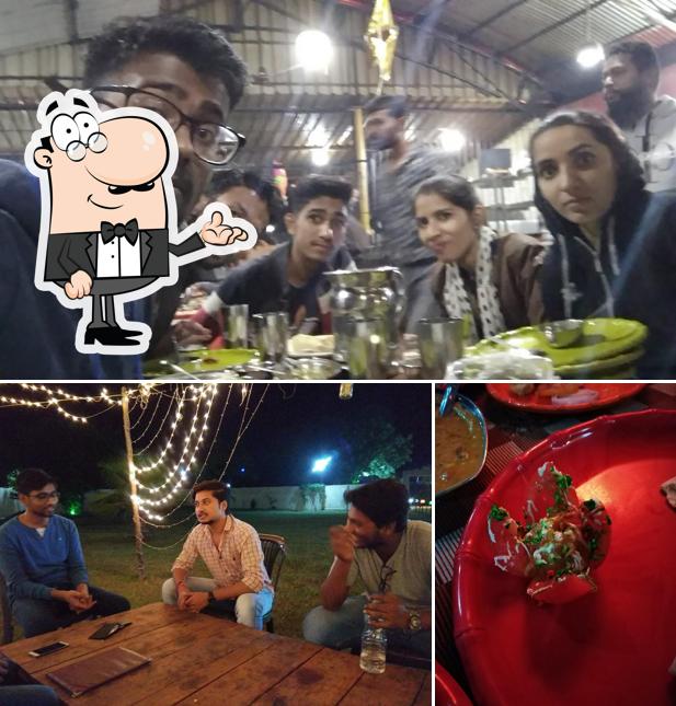 Take a seat at one of the tables at Arjun Da Dhaba - Best Veg Family Restaurant in Bhilai, Best Dhaba in Bhilai, Best Punjabi food in Bhilai