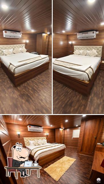 Take a seat at one of the tables at White Pearl Cruise Stay & Activities