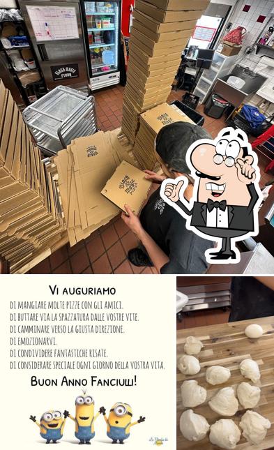 Dai un'occhiata agli interni di Magik Pizza