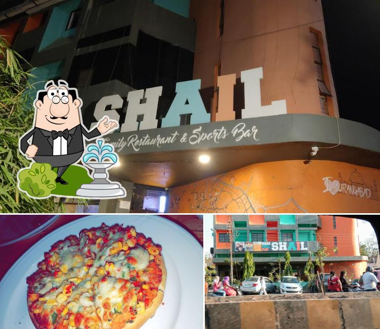 This is the picture depicting exterior and pizza at Shail's Floating Spirit