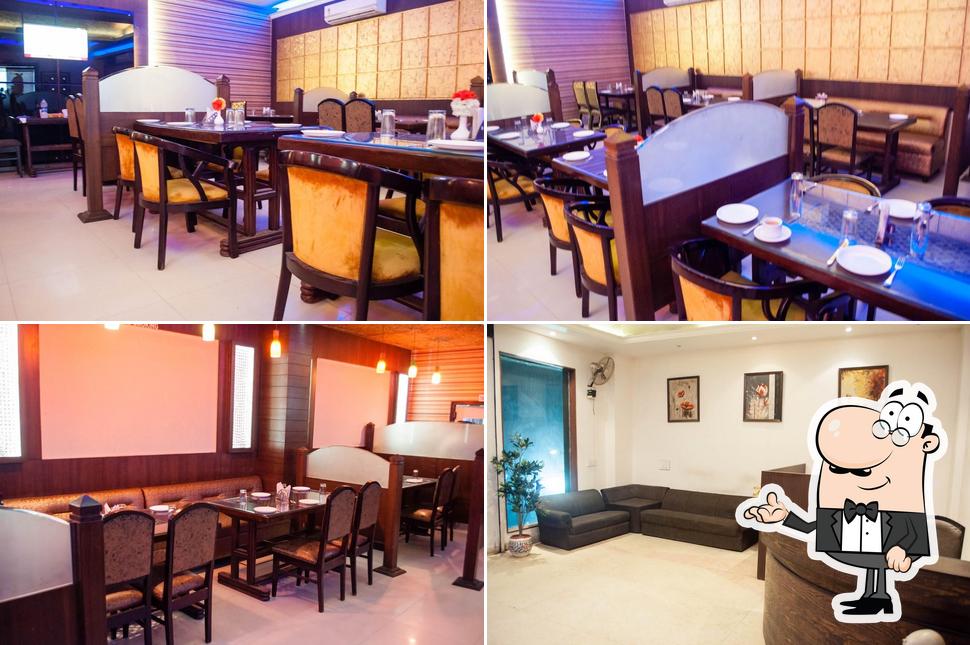 Take a seat at one of the tables at Hotel