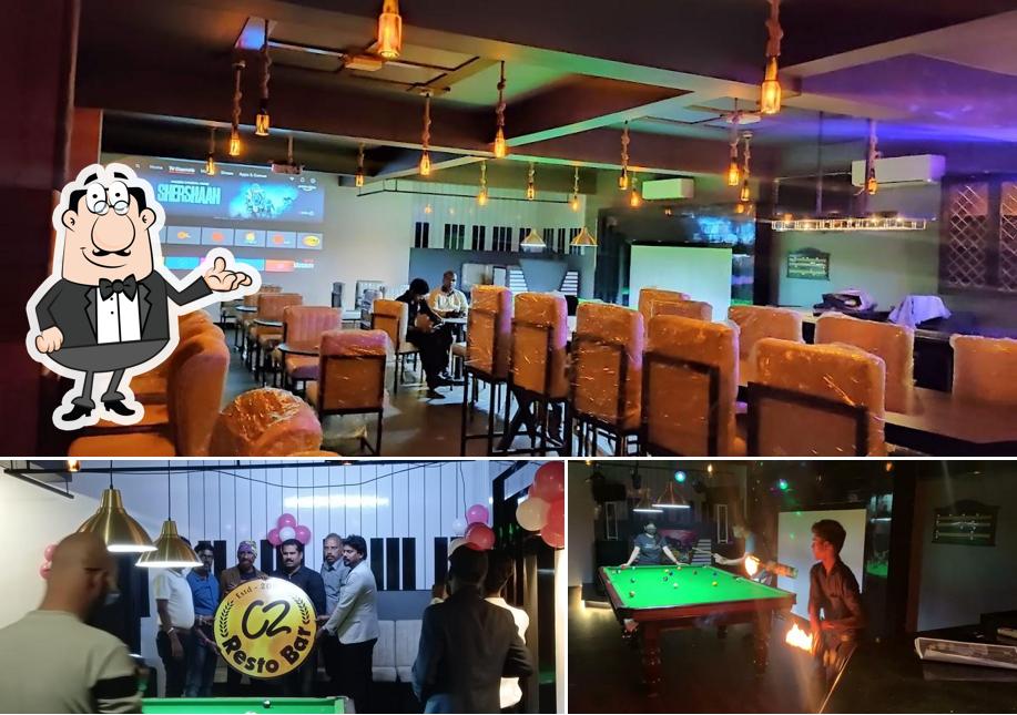 Take a seat at one of the tables at (C2 RESTOBAR)