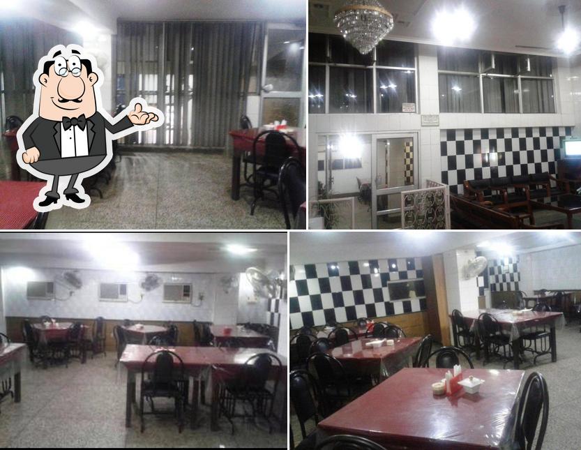 Take a seat at one of the tables at Gyan Vaishnav Hotel
