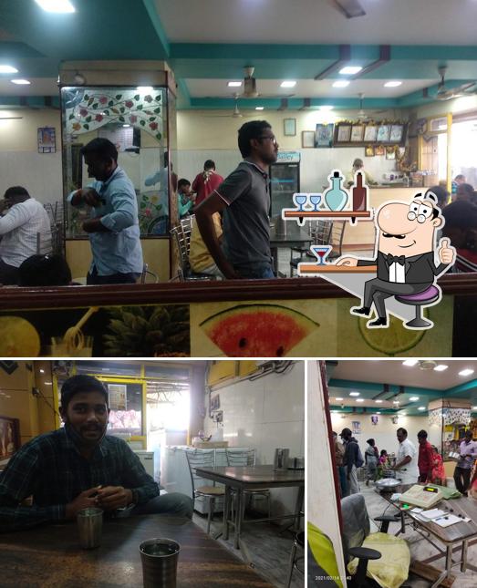Take a seat at one of the tables at Sri Lakshmi Srinivasa Bhavan
