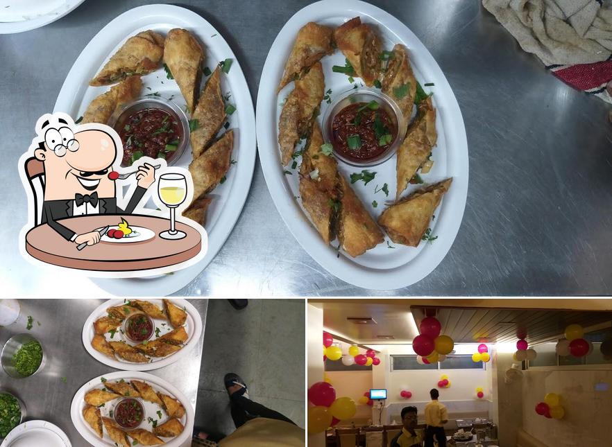 Check out the picture displaying food and interior at Sai Shabari's