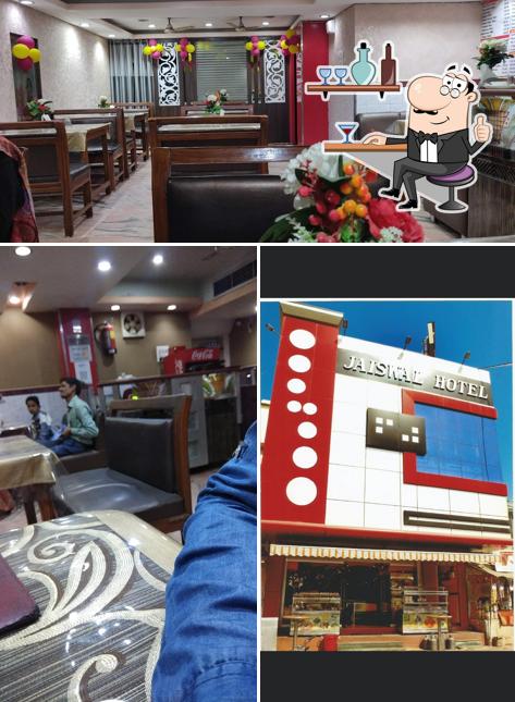 Take a seat at one of the tables at Jaiswal Hotel Pure Veg Restaurant