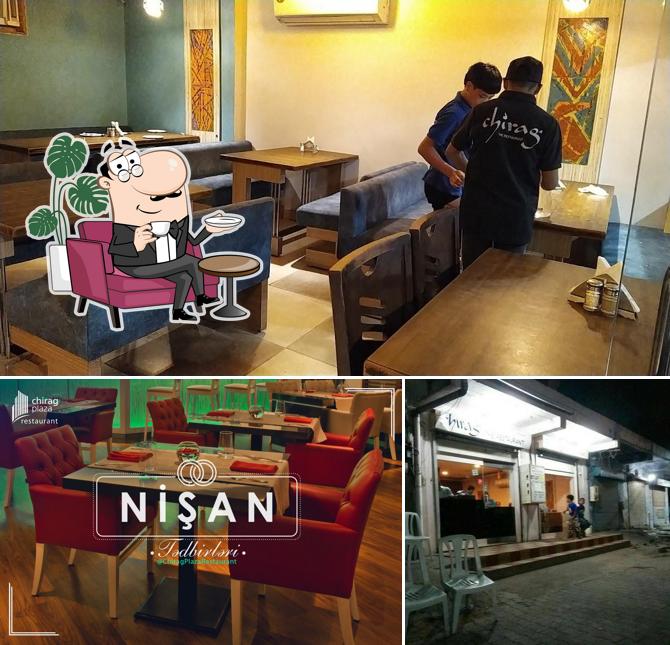 Take a seat at one of the tables at Chirag the restaurant