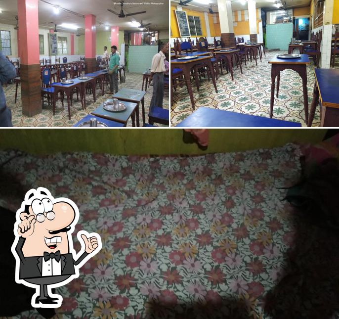 Take a seat at one of the tables at Maya Hotel