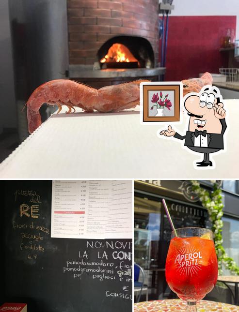 Questa è la immagine che presenta la interni e lavagna di Da Enrico Pizza d’asporto