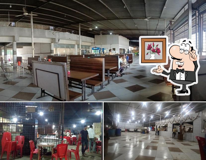 Take a seat at one of the tables at Hotel New Seema