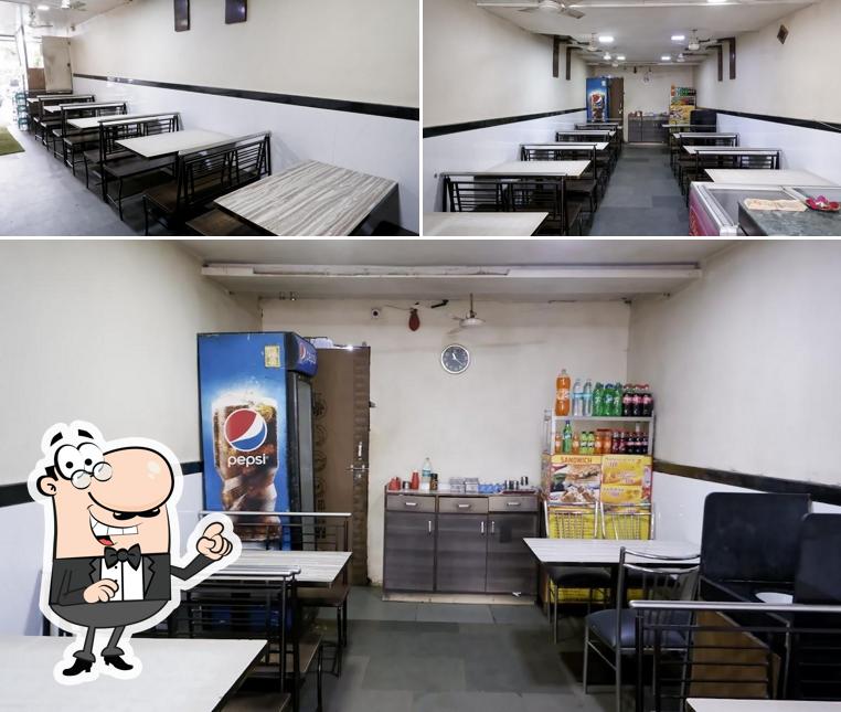 Take a seat at one of the tables at Shobha Veg Delight