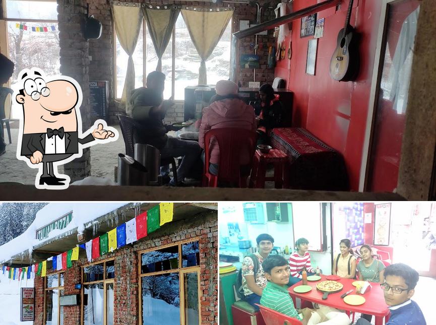 Take a seat at one of the tables at Italian Pizza Hut sethan